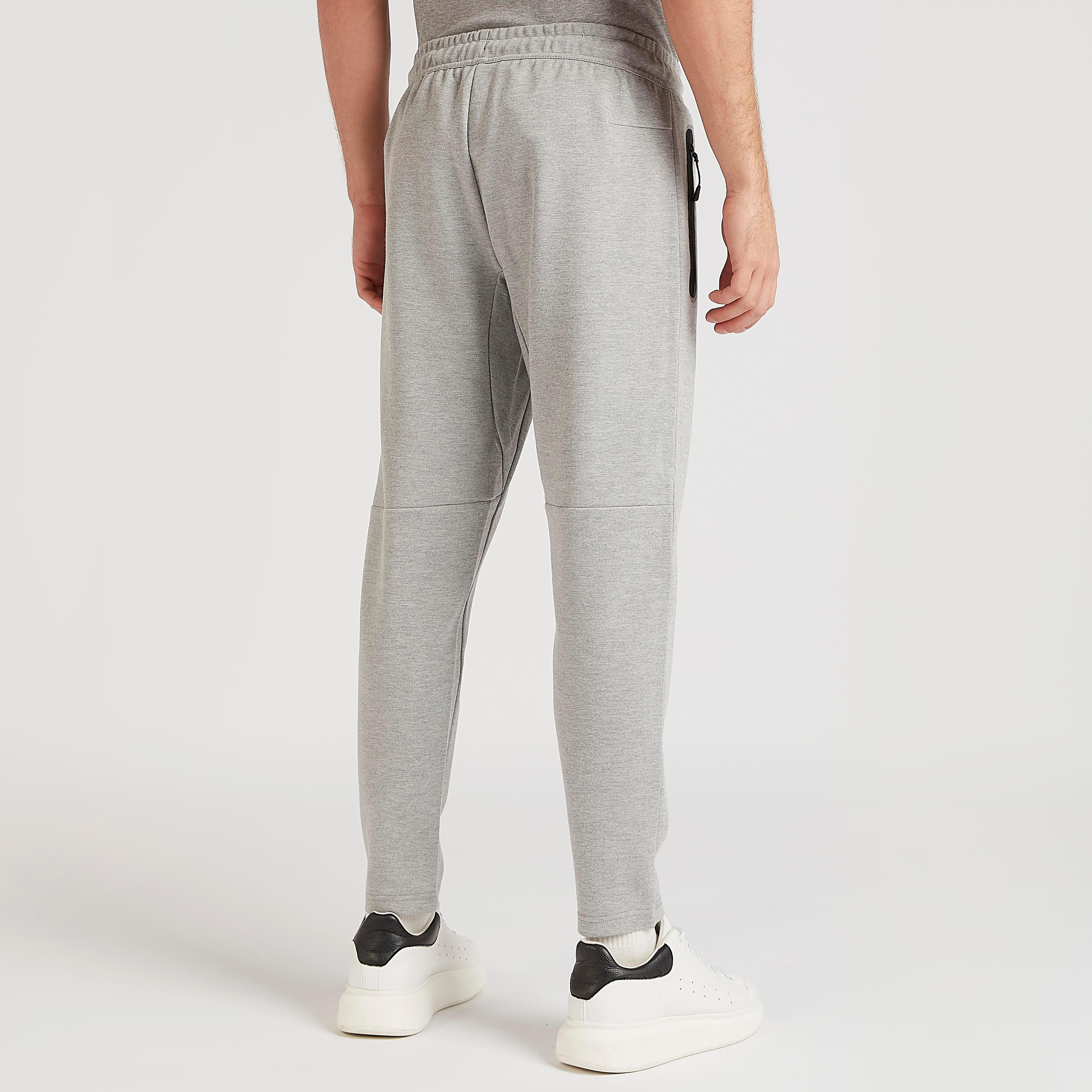 بنطلون رياضي سادة بخصر مطّاطي وجيوب من كابا-men-clothing-sportswearandactivewear-tracksuits-image-1