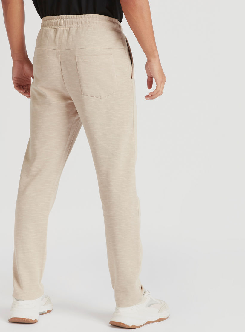 بنطلون رياضي سادة برباط إغلاق وجيوب من كابا-men-clothing-sportswearandactivewear-tracksuits-image-1