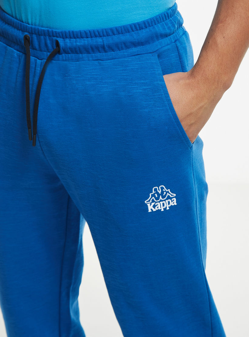 بنطلون رياضي سادة برباط إغلاق وجيوب من كابا-men-clothing-sportswearandactivewear-bottoms-image-1