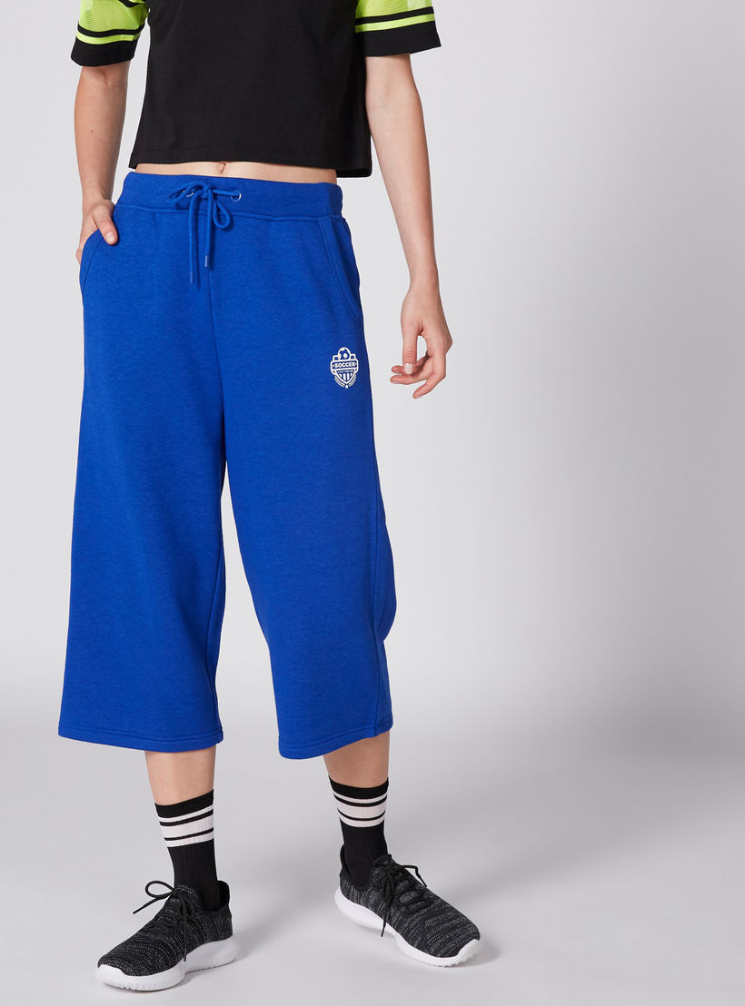 بنطال واسع الساقين بخصر مطّاطي ورباط وجيوب-women-clothing-bottoms-trousers-image-1