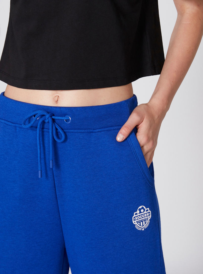 بنطال واسع الساقين بخصر مطّاطي ورباط وجيوب-women-clothing-bottoms-trousers-image-3