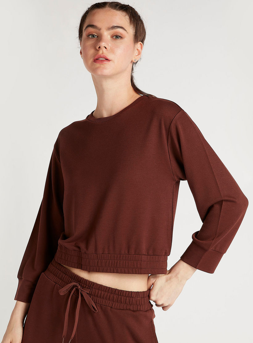 سويت شيرت سادة بأكمام طويلة وأطراف مطّاطيّة-women-clothing-sportswearandactivewear-hoodiesandsweatshirts-image-2