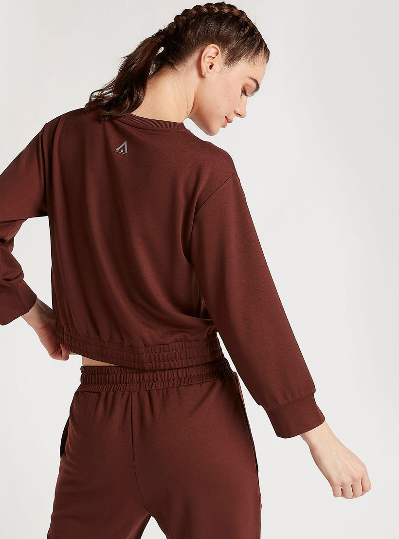سويت شيرت سادة بأكمام طويلة وأطراف مطّاطيّة-women-clothing-sportswearandactivewear-hoodiesandsweatshirts-image-1