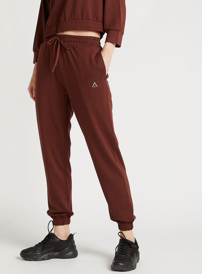 بنطلون رياضي سادة بجيوب وخصر مطّاطي-women-clothing-sportswearandactivewear-bottoms-image-5