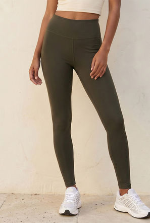 بنطلون ليقنز بيرفورمانس بخصر مرتفع-women-clothing-bottoms-leggings-image-1