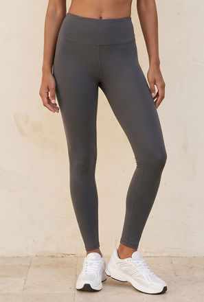 بنطلون ليقنز بيرفورمانس بخصر مرتفع-women-clothing-bottoms-leggings-image-1