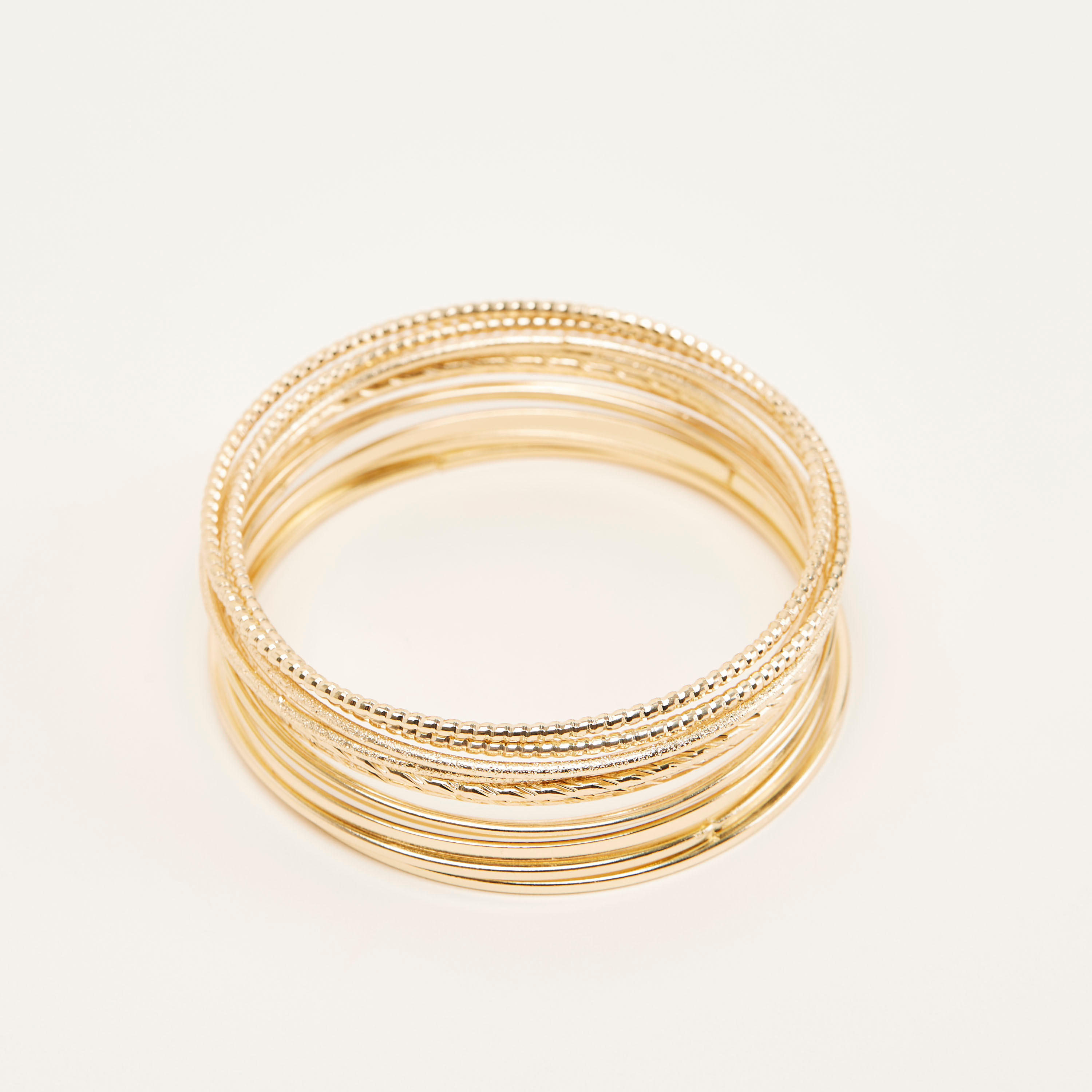أساور ميتاليك بارزة الملمس - طقم من 12-women-watchesandjewellery-jewellery-banglesandbracelets-image-1