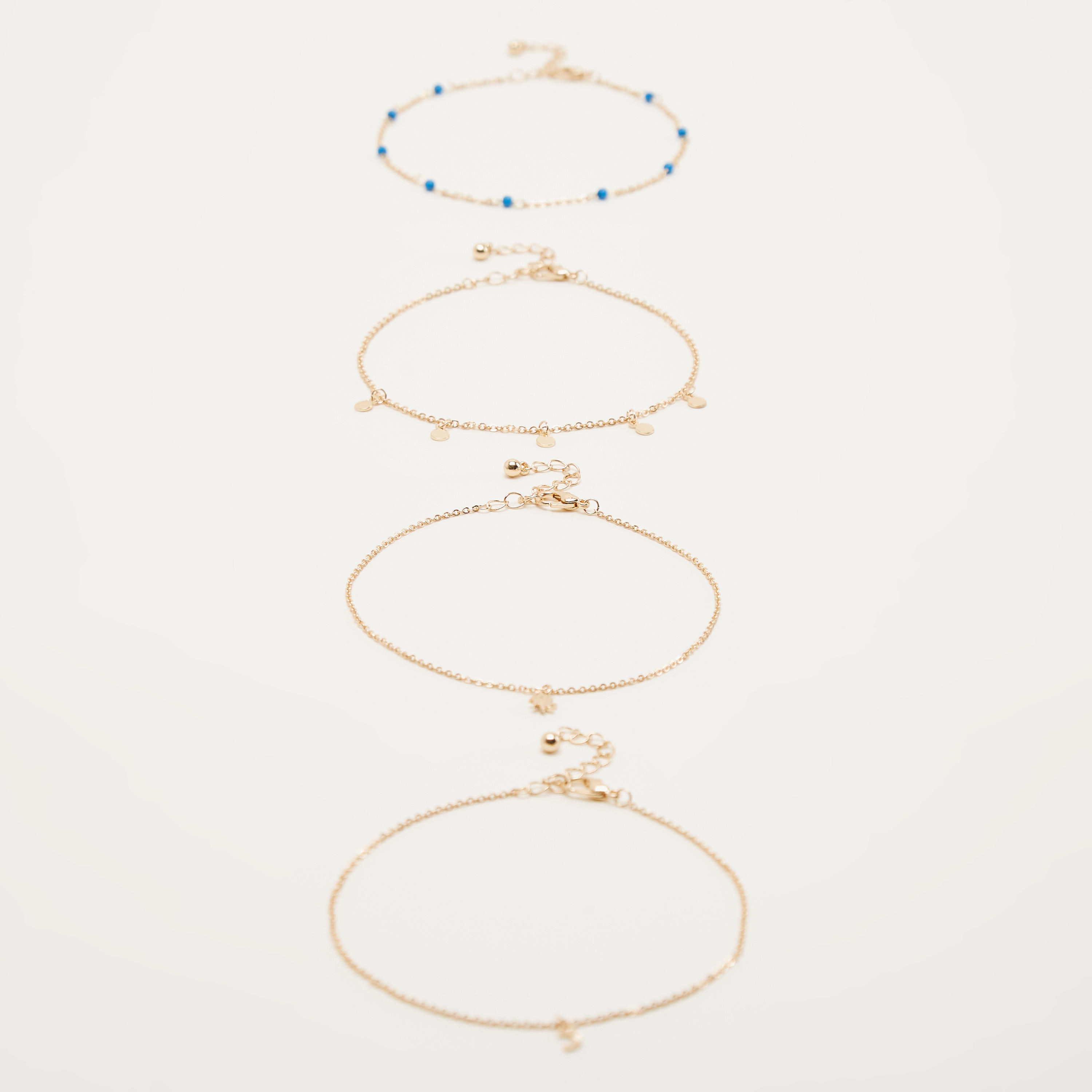 خلخال مزين بمشبك إغلاق - طقم من 4-women-watchesandjewellery-jewellery-anklets-image-1