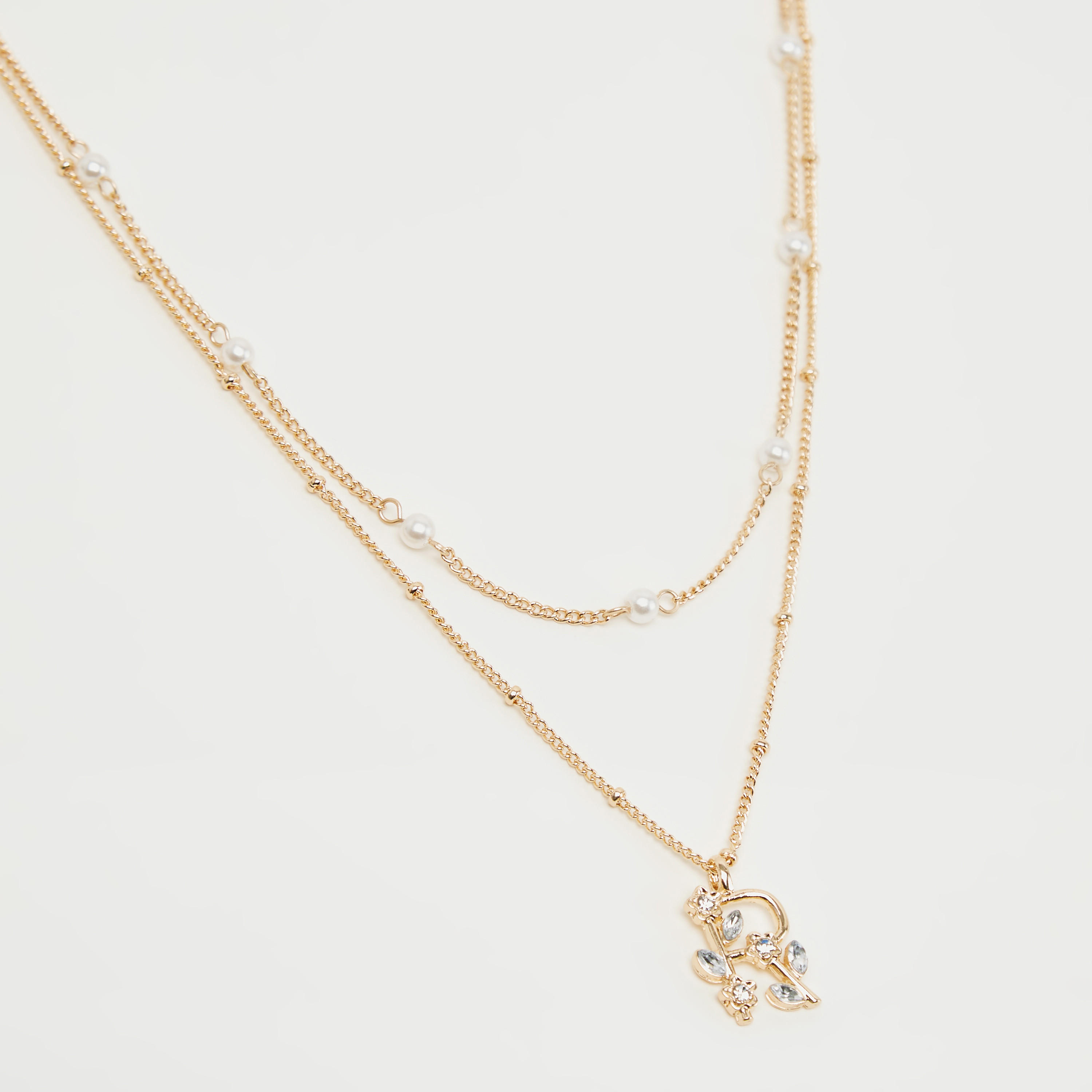 قلادة متعدّدة الطبقات مزيّنة بدلّاية حرف أر-women-watchesandjewellery-jewellery-necklacesandpendants-image-1