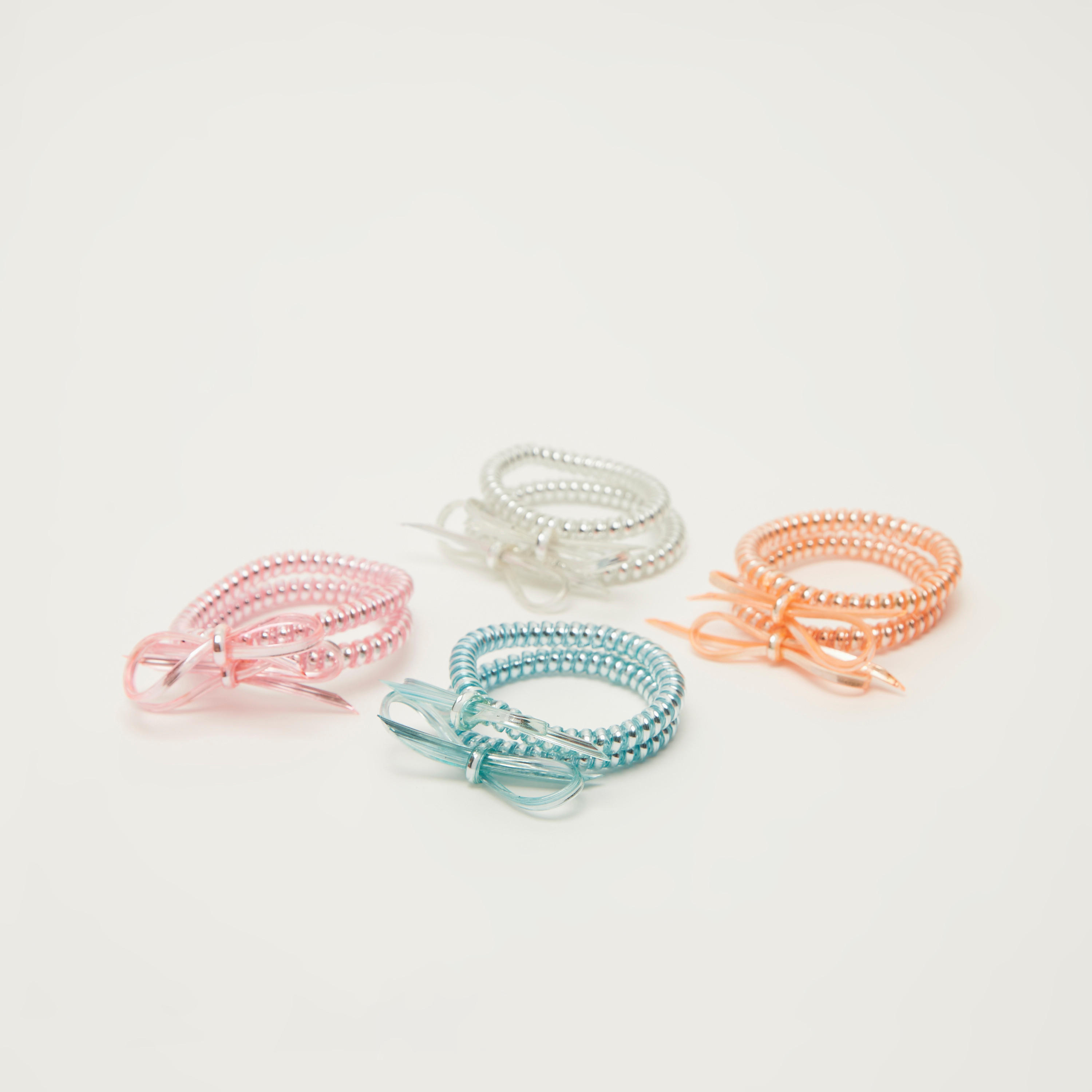 ربطات شعر لولبية منقوشة بتفاصيل فيونكة- مجموعة من 8 قطع-women-hairaccessories-image-1