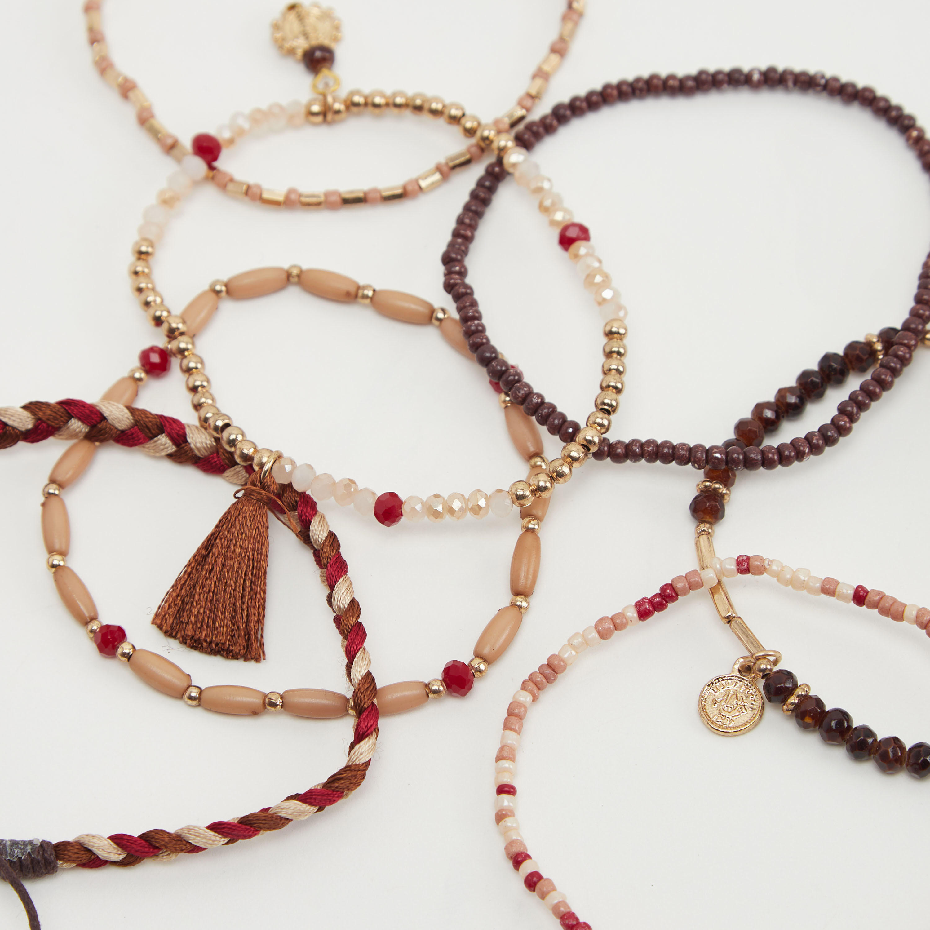 أساور مزيّنة بالخرز - طقم من 9 قطع-women-watchesandjewellery-jewellery-banglesandbracelets-image-1