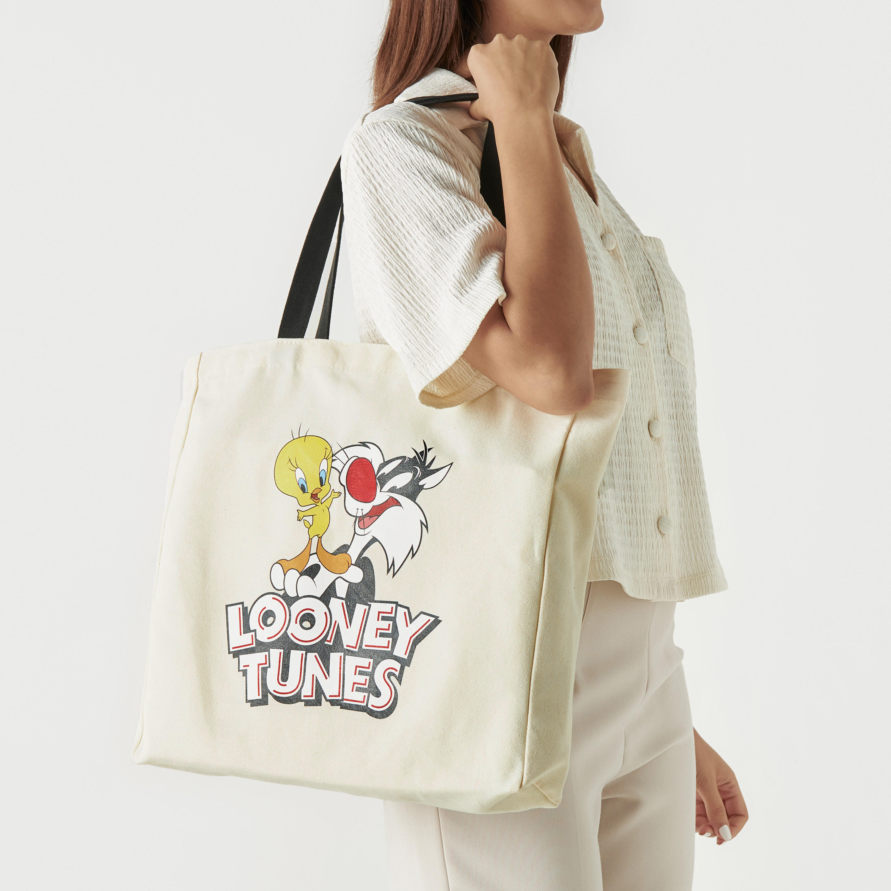 شنطة توتي بمقابض مزدوجة وطبعات لوني تيونز-women-bagsandwallets-handbags-image-2