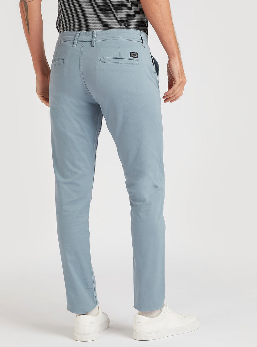 بنطلون شينو سادة بقصّة سليم وخصر متوسّط الارتفاع وجيوب-men-clothing-bottoms-trousersandchinos-trousers-image-1
