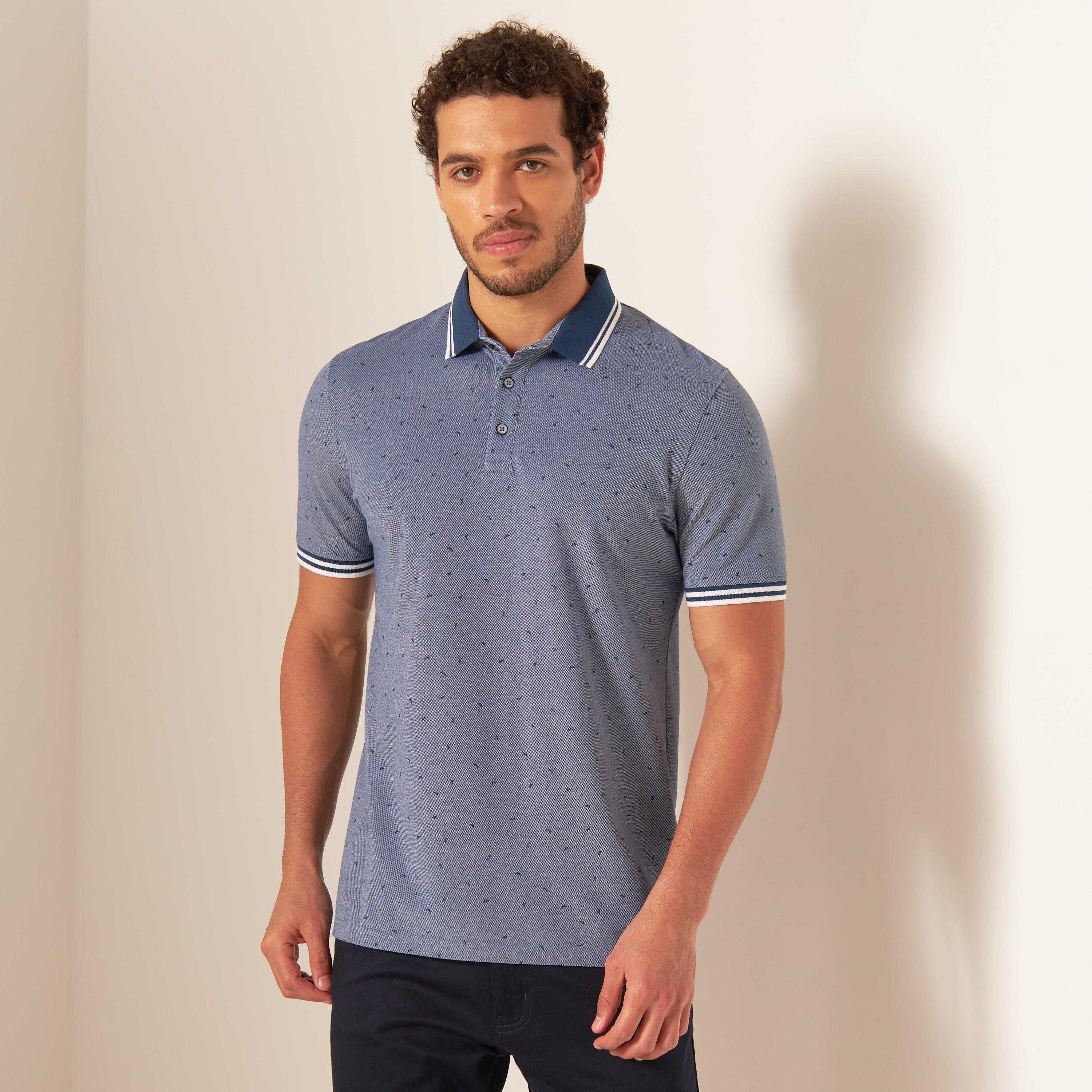 تيشيرت بولو بأكمام قصيرة وأزرار إغلاق وطبعات-men-clothing-tshirtsandpolos-polos-image-1