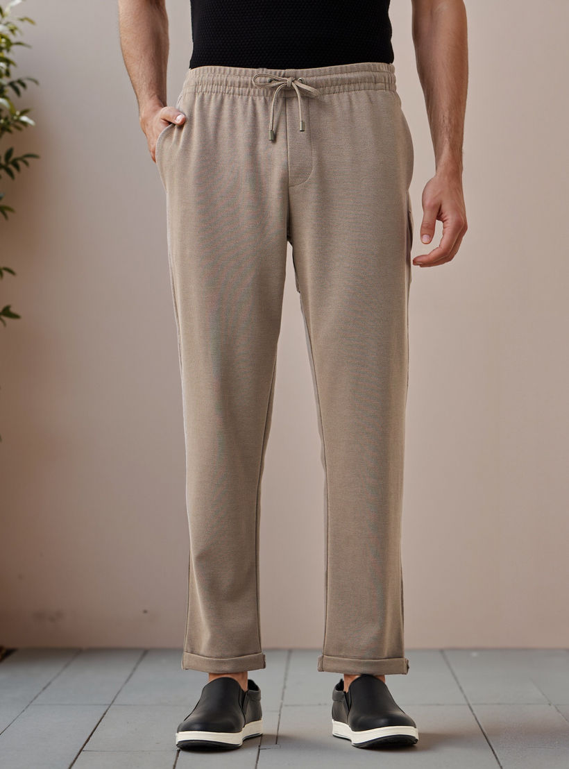 بنطلون بيكيه بقصّة سليم وخصر مطاطي -men-clothing-bottoms-trousersandchinos-trousers-image-1