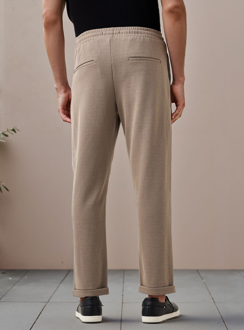 بنطلون بيكيه بقصّة سليم وخصر مطاطي -men-clothing-bottoms-trousersandchinos-trousers-image-3