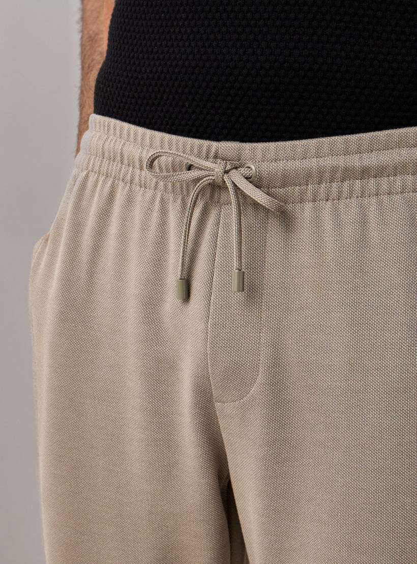 بنطلون بيكيه بقصّة سليم وخصر مطاطي -men-clothing-bottoms-trousersandchinos-trousers-image-4