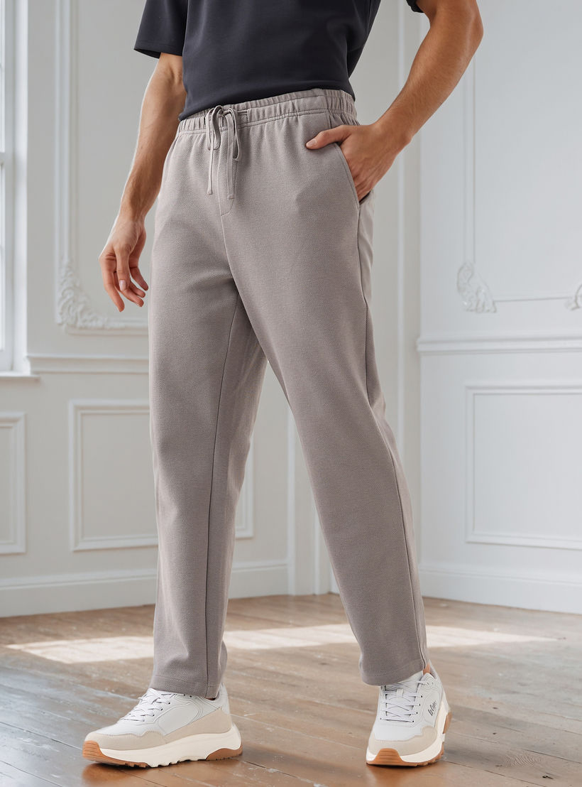 بنطلون رجالي بخصر مرن وقصة عادية وجيوب-men-clothing-bottoms-joggers-image-1