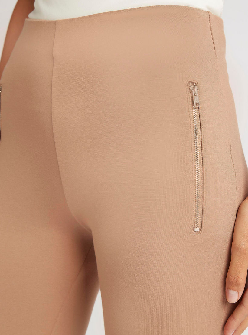 بنطلون تريقنز سادة بجيوب بسحاب-women-clothing-bottoms-leggings-image-2