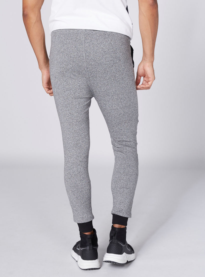 بنطال رياضي بطبعات سمايلي وورلد وجيوب-men-clothing-bottoms-joggers-image-2