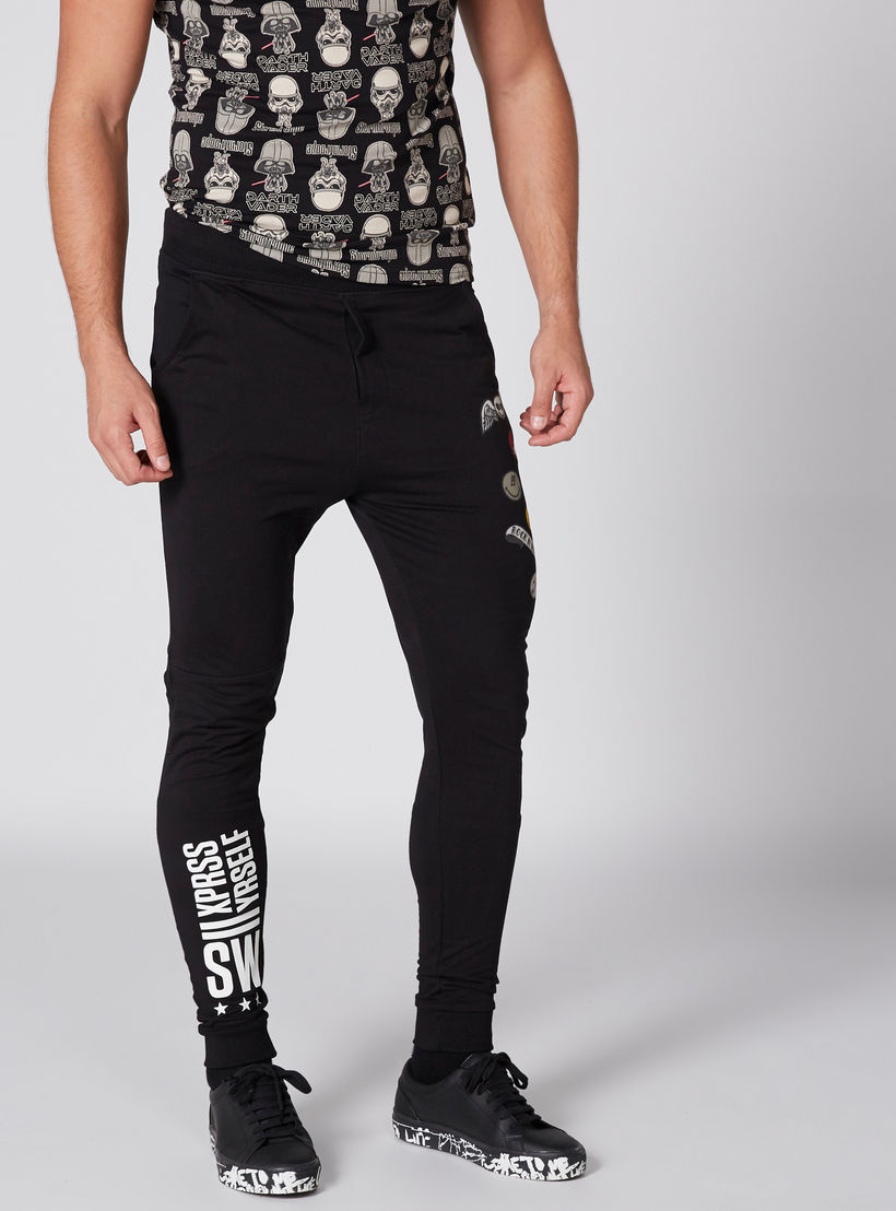 بنطال رياضي طويل بجيوب وطبعات سمايلي وورلد-men-clothing-bottoms-joggers-image-1