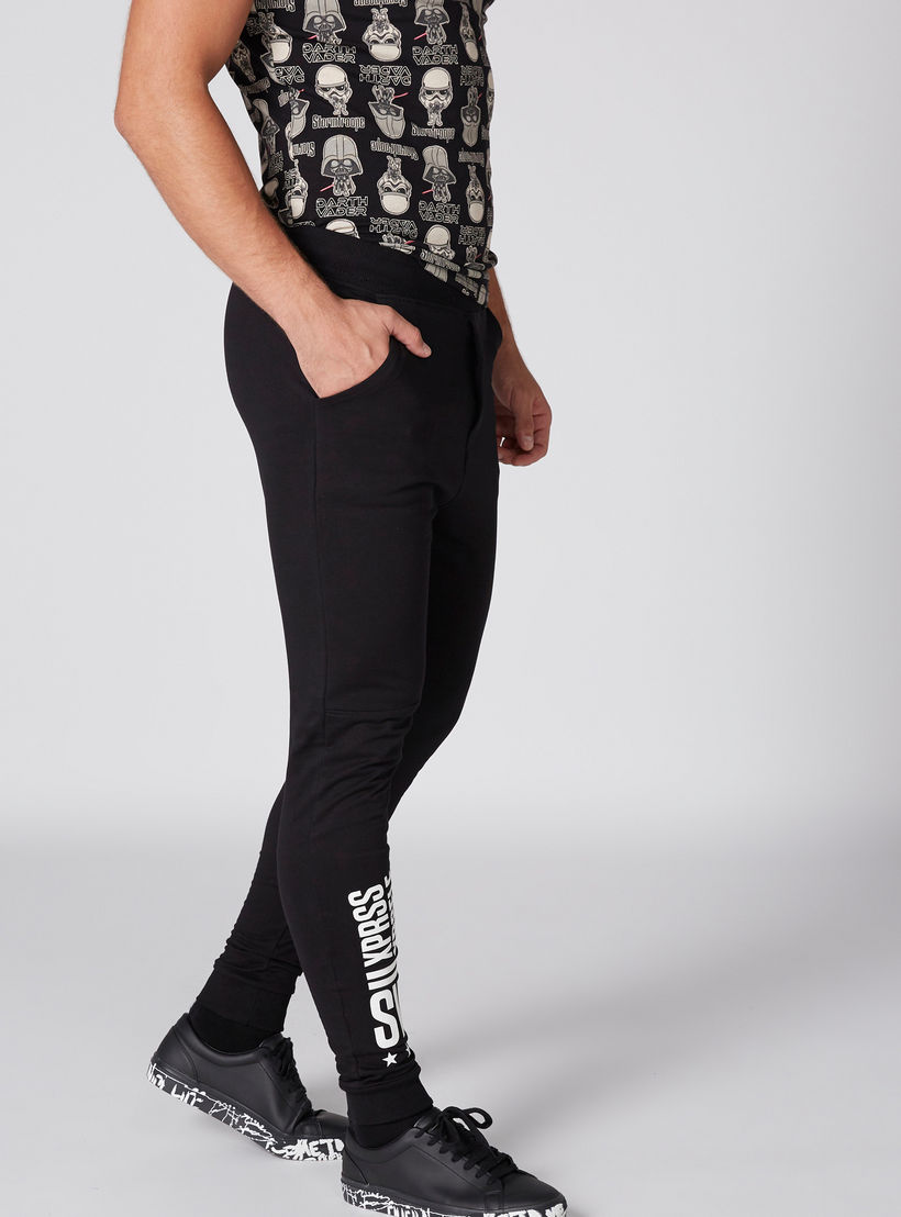 بنطال رياضي طويل بجيوب وطبعات سمايلي وورلد-men-clothing-bottoms-joggers-image-3