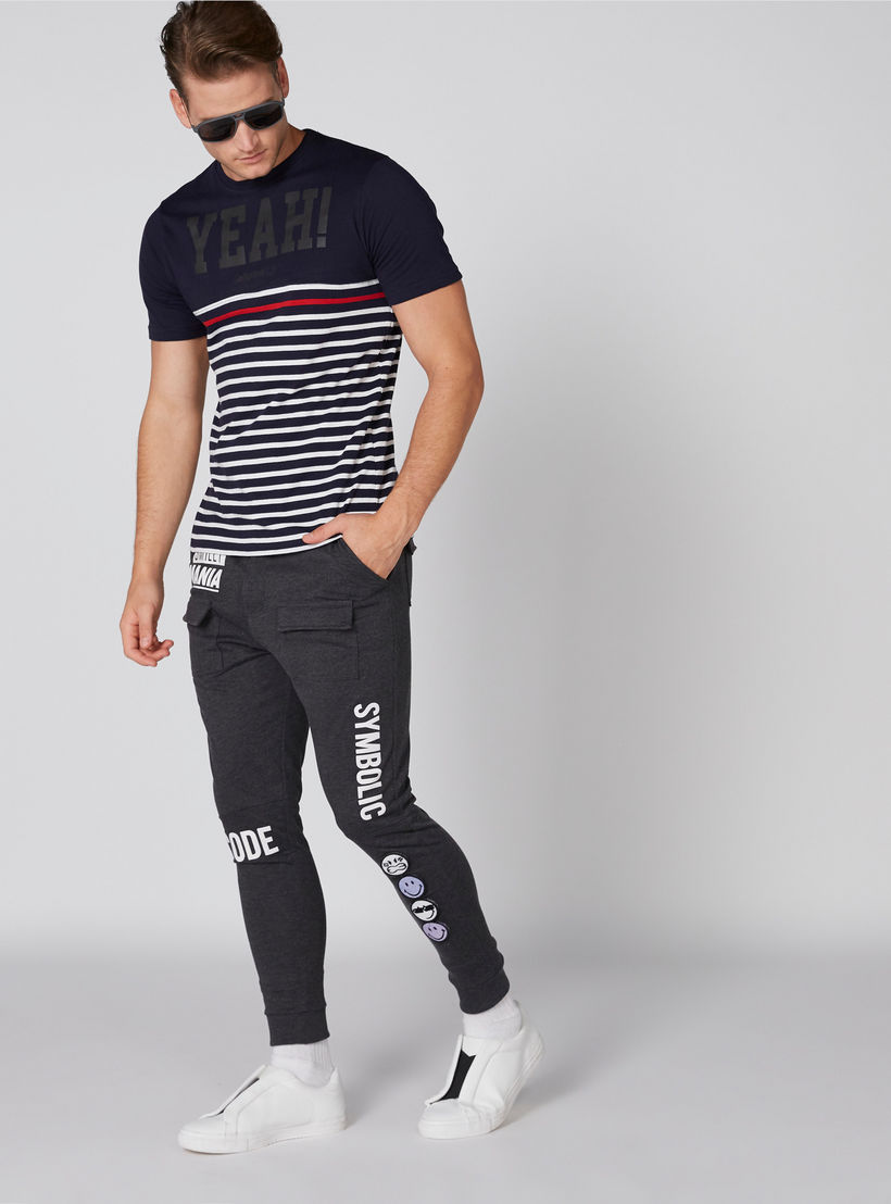 بنطال رياضي طويل بجيوب ونقش سمايلي وورلد-men-clothing-bottoms-joggers-image-1