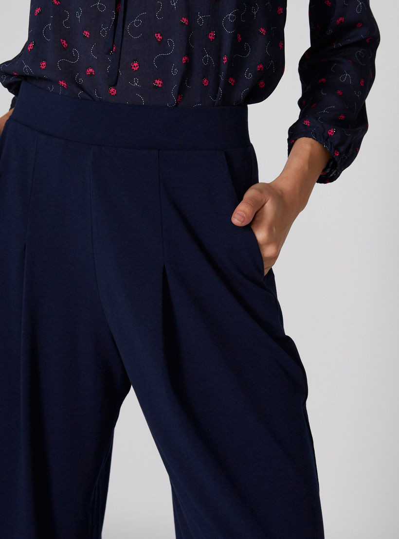 بنطال واسع الساقين بخصر مطّاطي وجيوب-women-clothing-bottoms-trousers-image-4