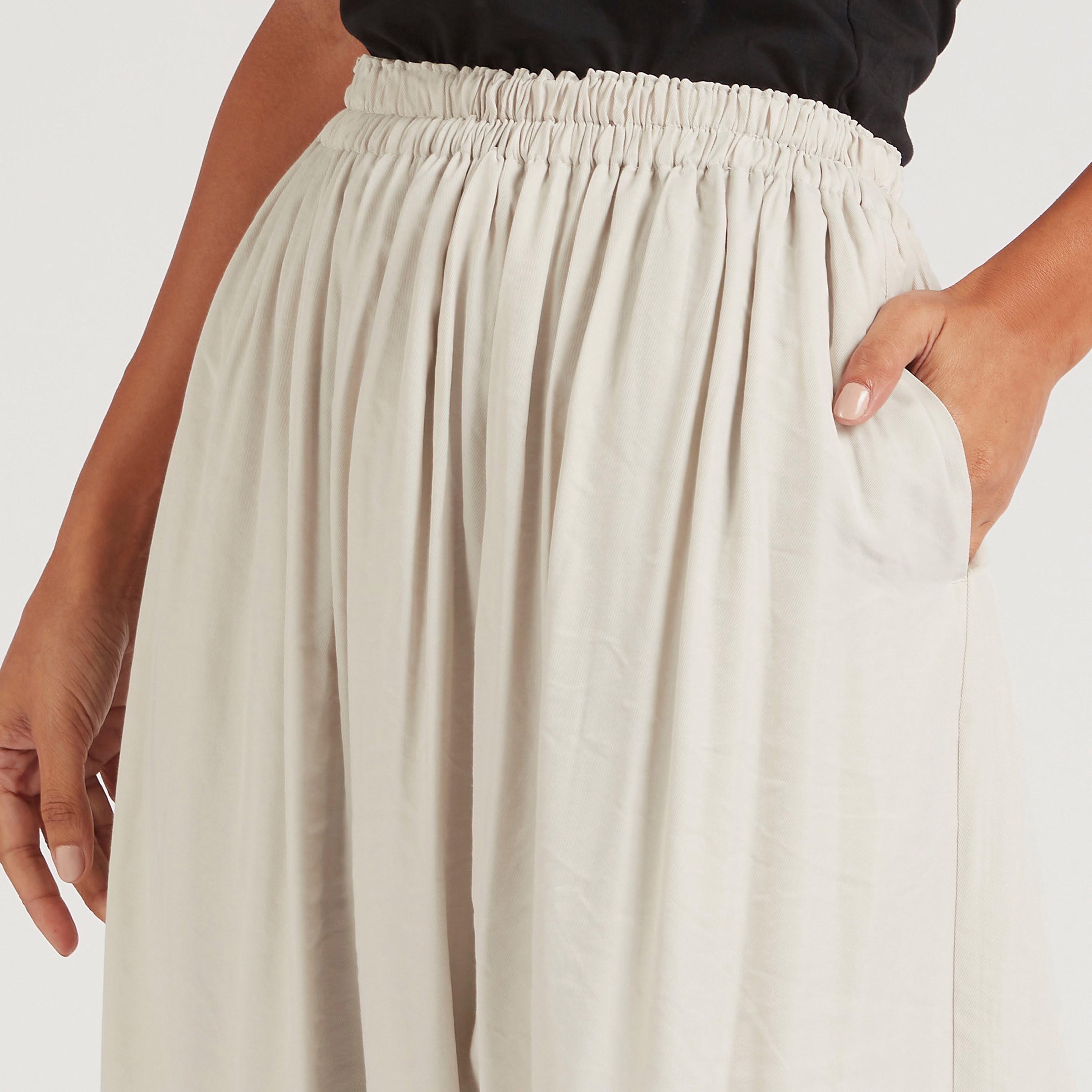 تنورة إيه لاين ميدي سادة بخصر مطّاطي-women-clothing-bottoms-skirts-image-2