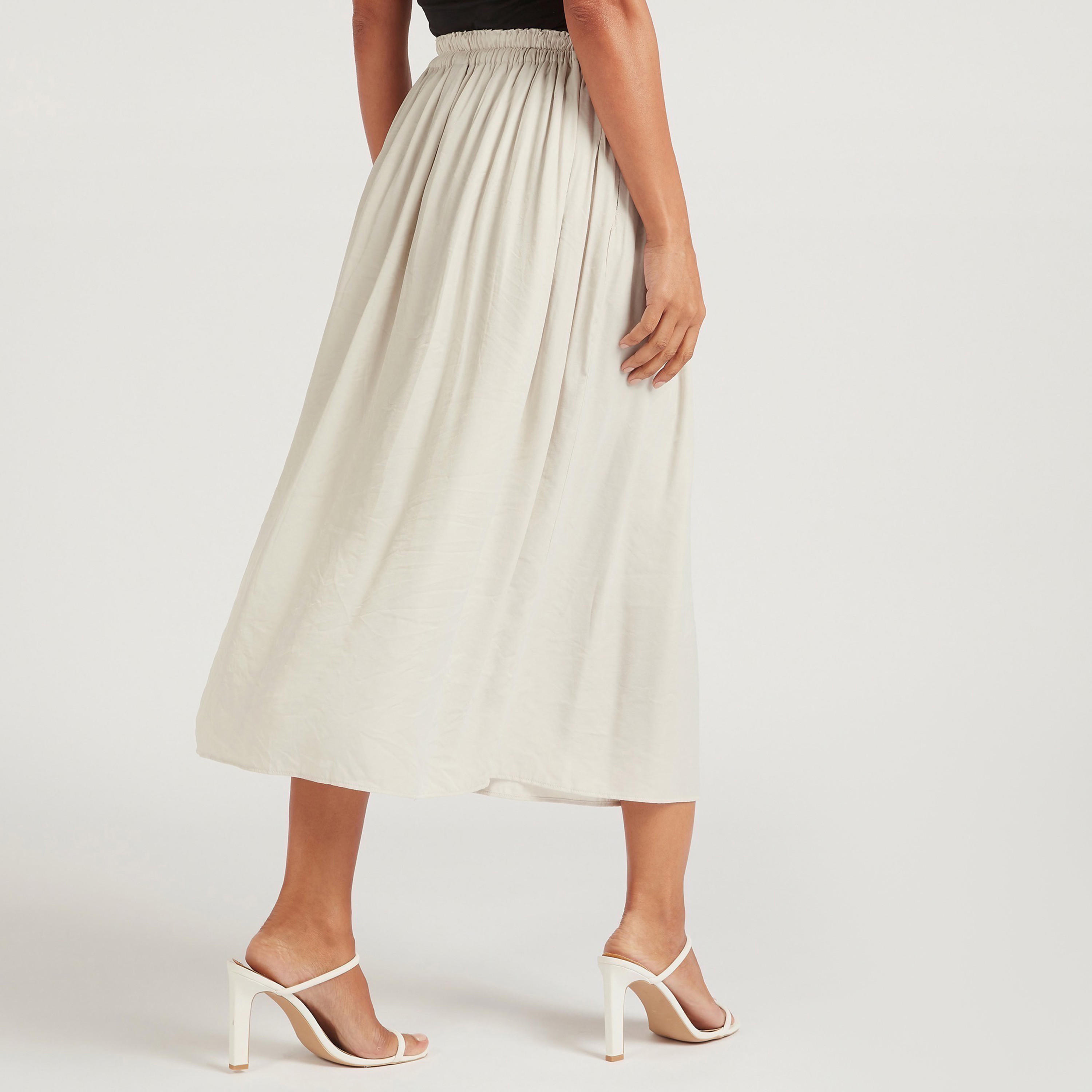 تنورة إيه لاين ميدي سادة بخصر مطّاطي-women-clothing-bottoms-skirts-image-1