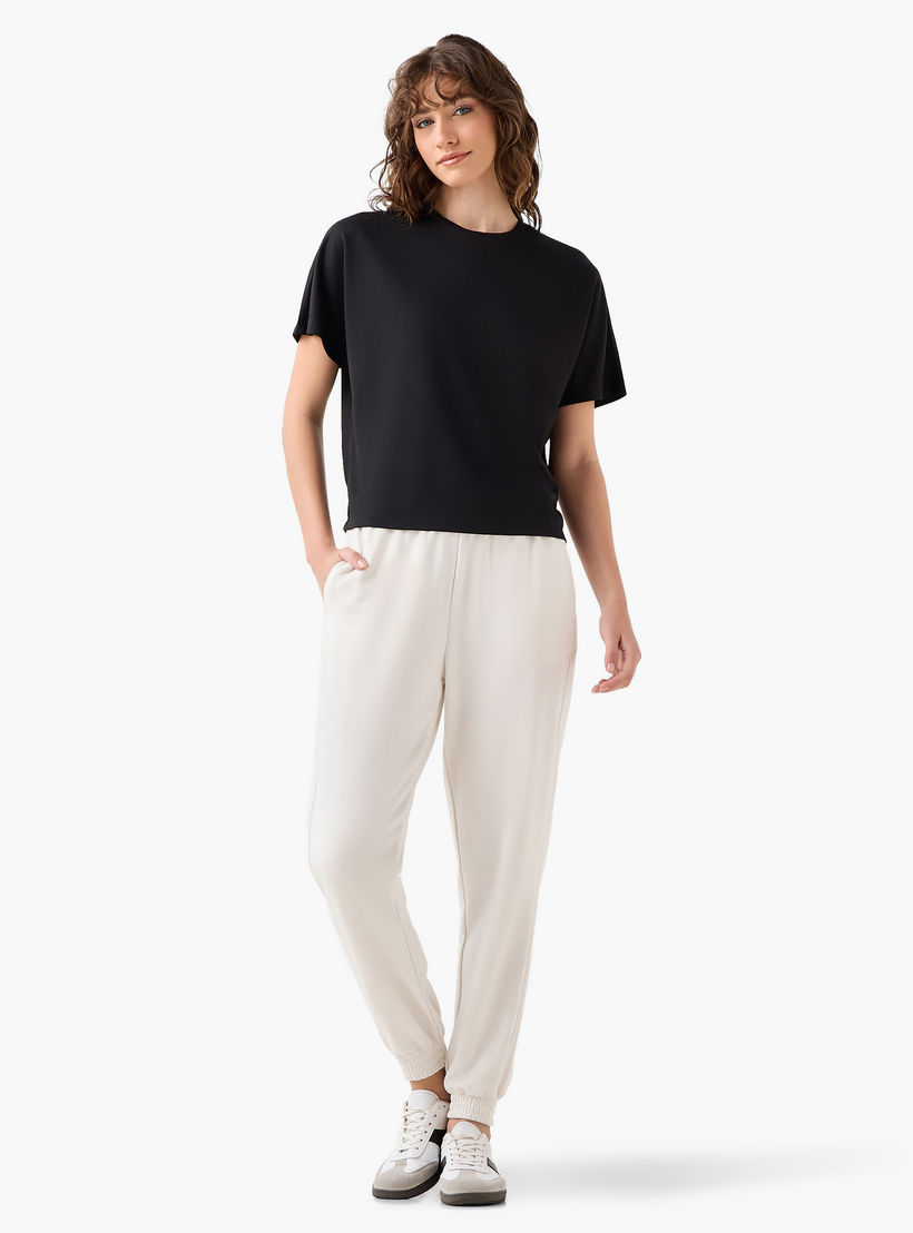 بنطلون رياضي بخصر مرن وجيوب-women-clothing-bottoms-joggers-image-3