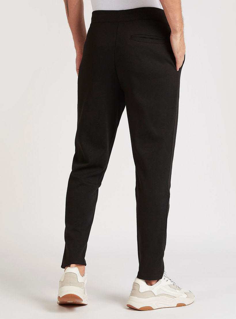 بنطلون سادة بخصر فليكسي وجيوب-men-clothing-bottoms-trousersandchinos-trousers-image-1