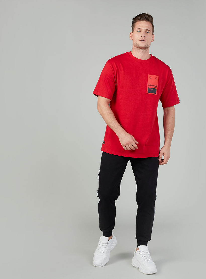 بنطلون رياضي سادة بخصر متوسط الارتفاع وجيوب وشريطة إكسبو 2020-men-clothing-sportswearandactivewear-bottoms-image-2