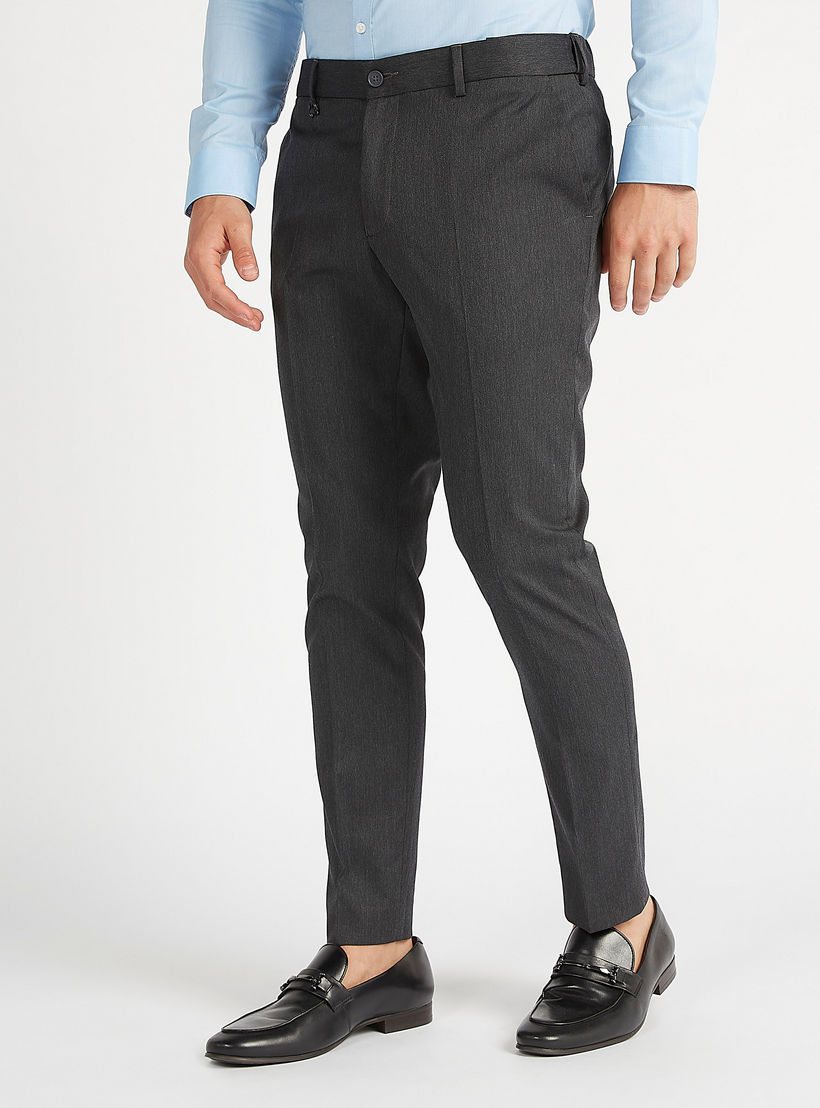 بنطلون سادة سكيني فيت بخصر متوسط الإرتفاع وتفاصيل جيوب وعراوي حزام-men-clothing-bottoms-trousersandchinos-trousers-image-1