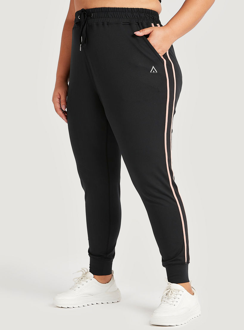 بنطلون رياضي بتفاصيل شريطة وخصر مطّاطي متوسّط الارتفاع وجيوب-women-clothing-bottoms-joggers-image-1