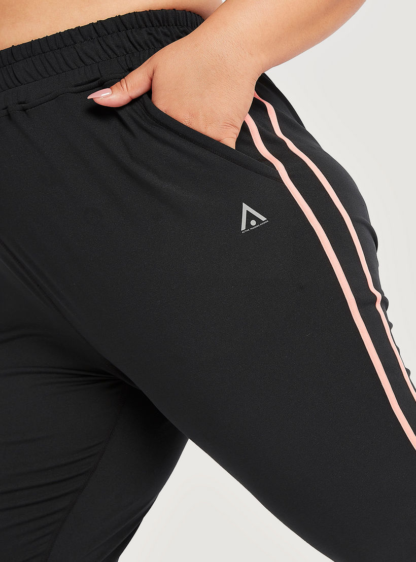 بنطلون رياضي بتفاصيل شريطة وخصر مطّاطي متوسّط الارتفاع وجيوب-women-clothing-bottoms-joggers-image-3