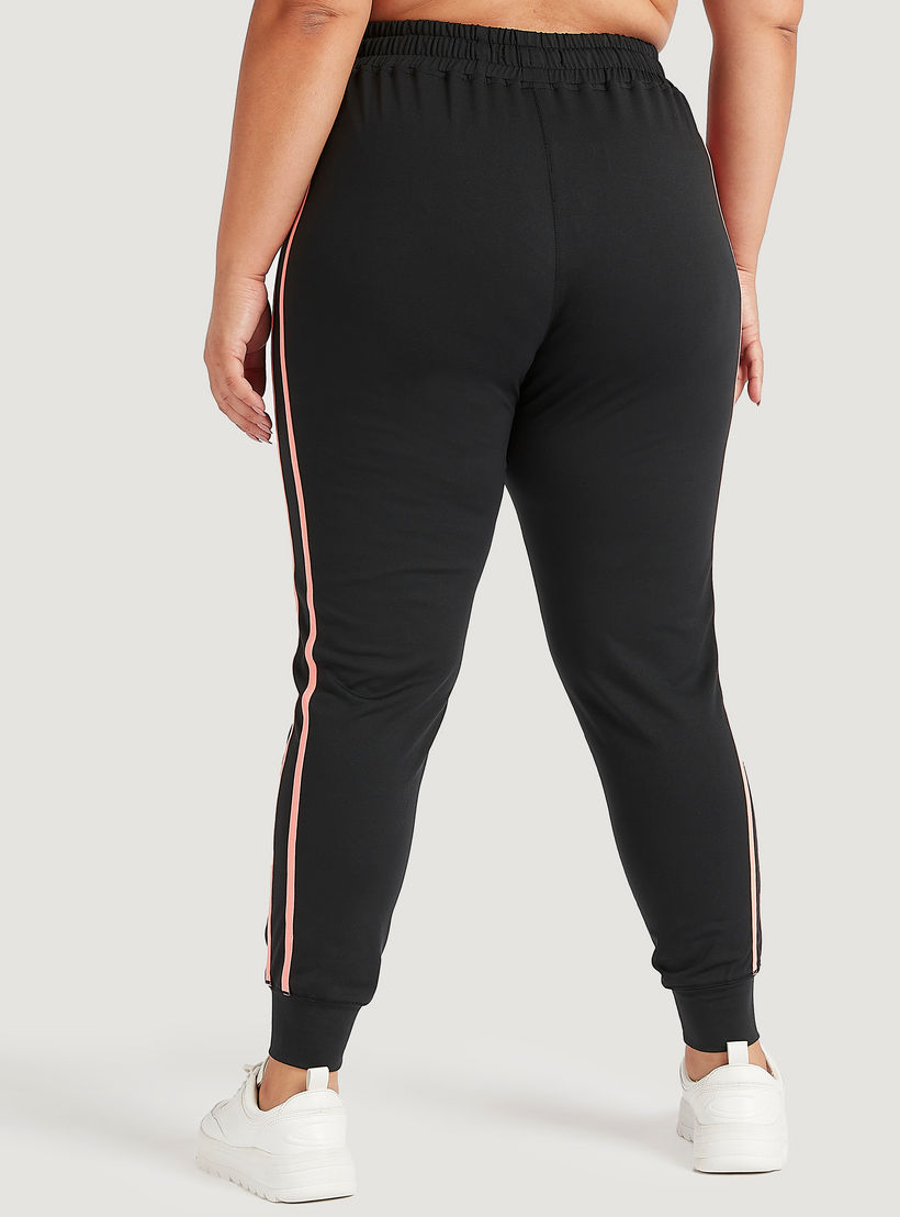 بنطلون رياضي بتفاصيل شريطة وخصر مطّاطي متوسّط الارتفاع وجيوب-women-clothing-bottoms-joggers-image-4