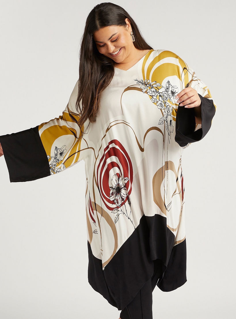 بلوزة مزّينة بنقوش تجريدية مع ياقة V وأطراف غير متماثلة-women-clothing-shirtsandblouses-blouses-image-1