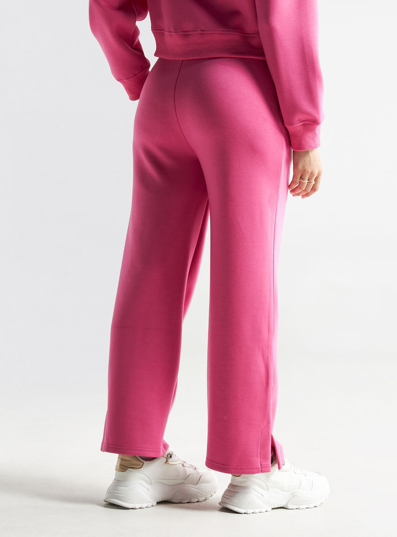 بنطلون سادة بقصّة مريحة ورباط إغلاق وجيوب-women-clothing-bottoms-trousers-image-2