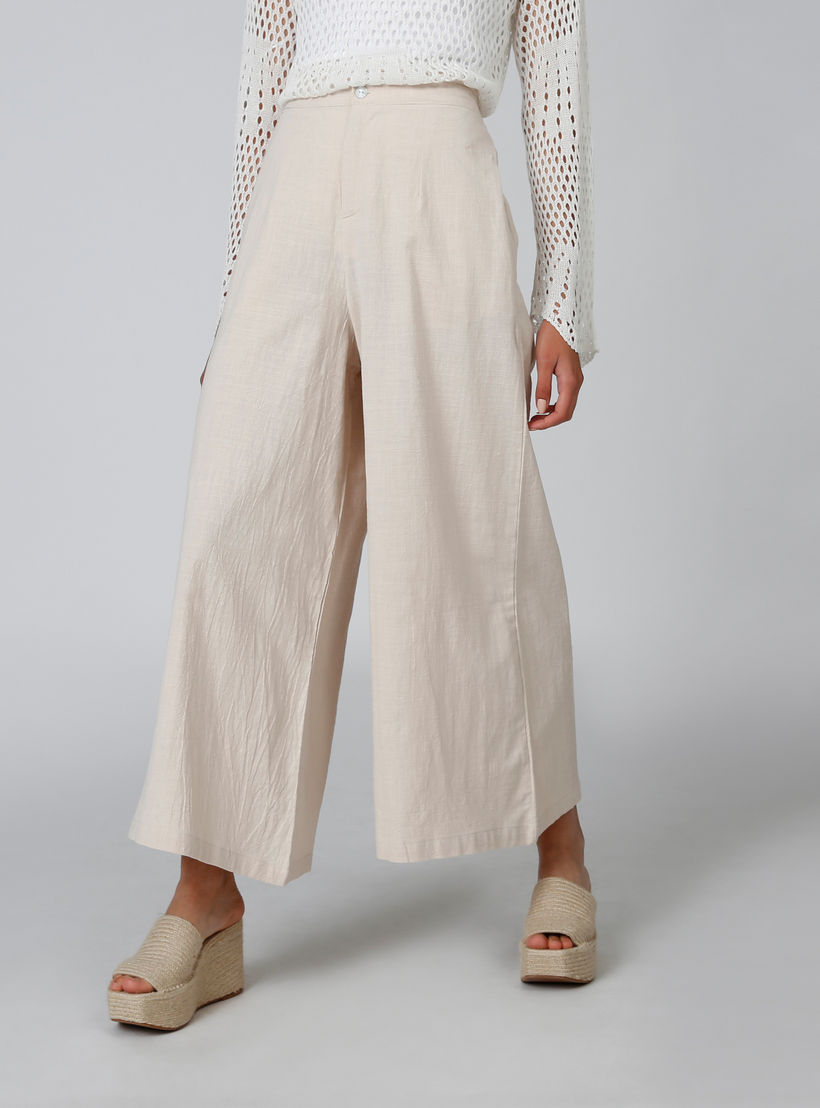 بنطلون بالازو سادة بقصّة واسعة وخصر متوسط الارتفاع وجيوب-women-clothing-bottoms-trousers-image-1