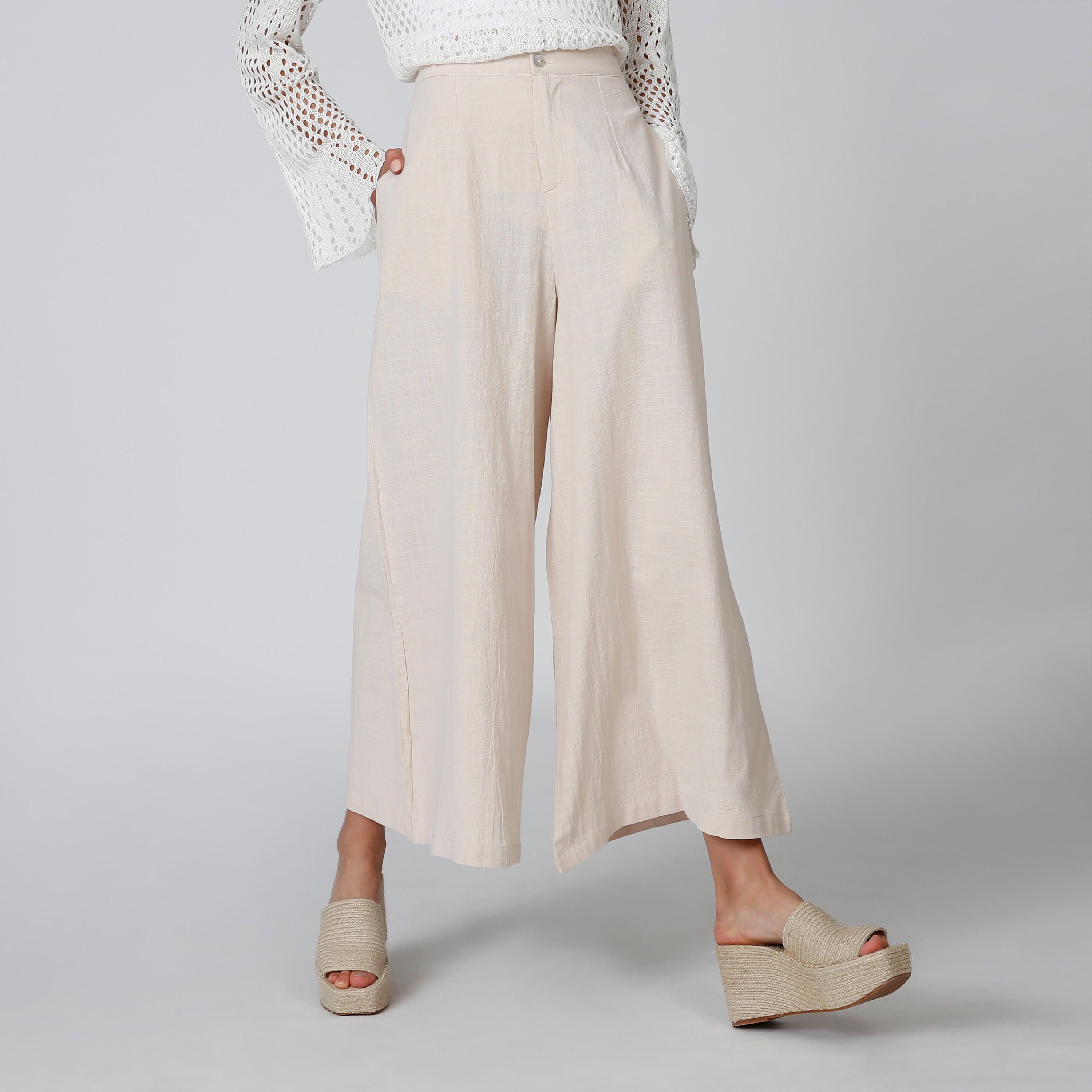 بنطلون بالازو سادة بقصّة واسعة وخصر متوسط الارتفاع وجيوب-women-clothing-bottoms-trousers-image-2