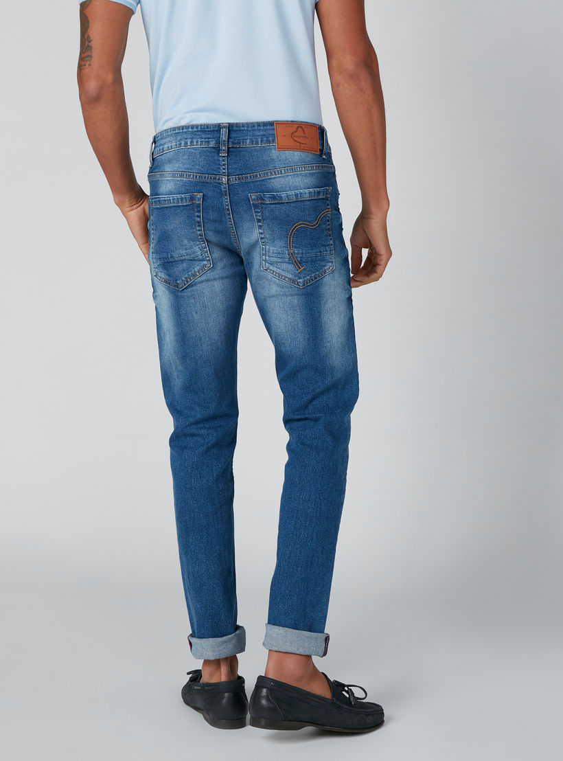 بنطلون مستدام جينز سكيني بخصر منخفض من بيينج هيومان-men-clothing-bottoms-jeans-image-1