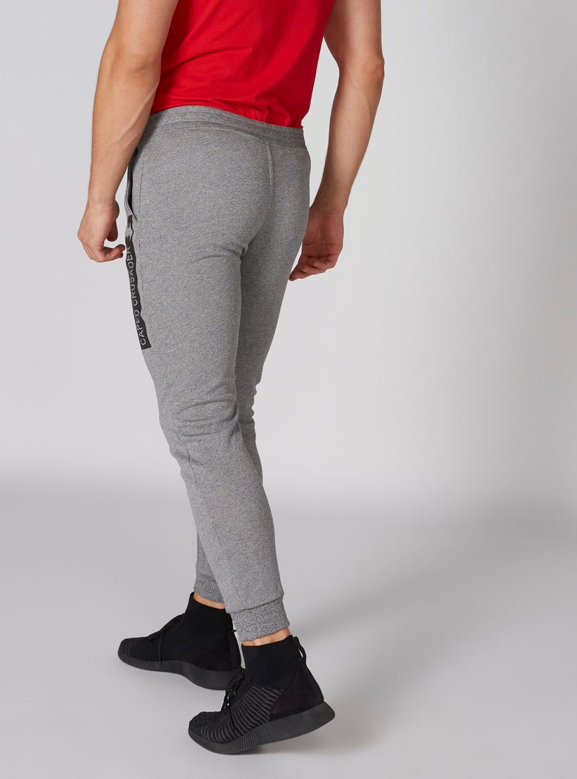 بنطال رياضي بطبعات باتمان وزر إغلاق وجيوب-men-clothing-bottoms-joggers-image-2