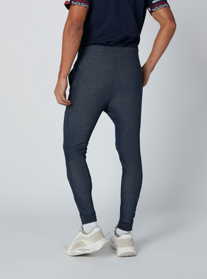بنطال رياضي بخصر مطّاطي متوسط الارتفاع وجيوب-men-clothing-bottoms-joggers-image-2