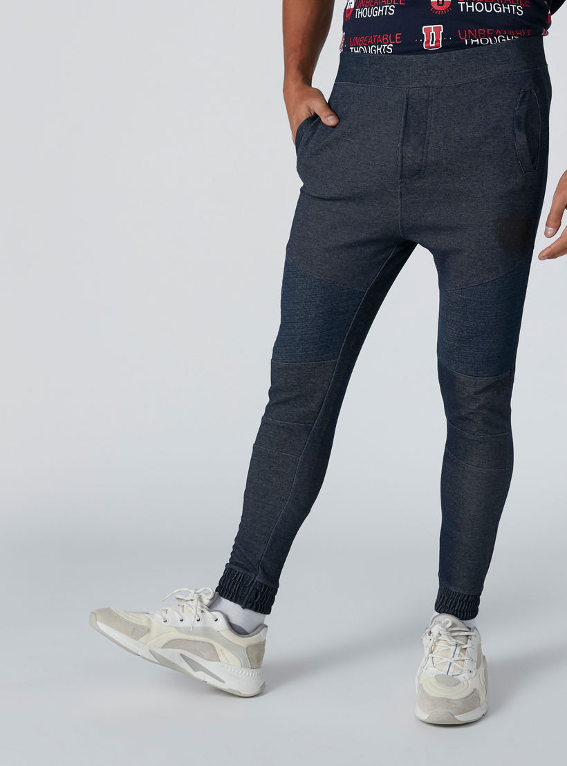 بنطال رياضي بخصر مطّاطي متوسط الارتفاع وجيوب-men-clothing-bottoms-joggers-image-3