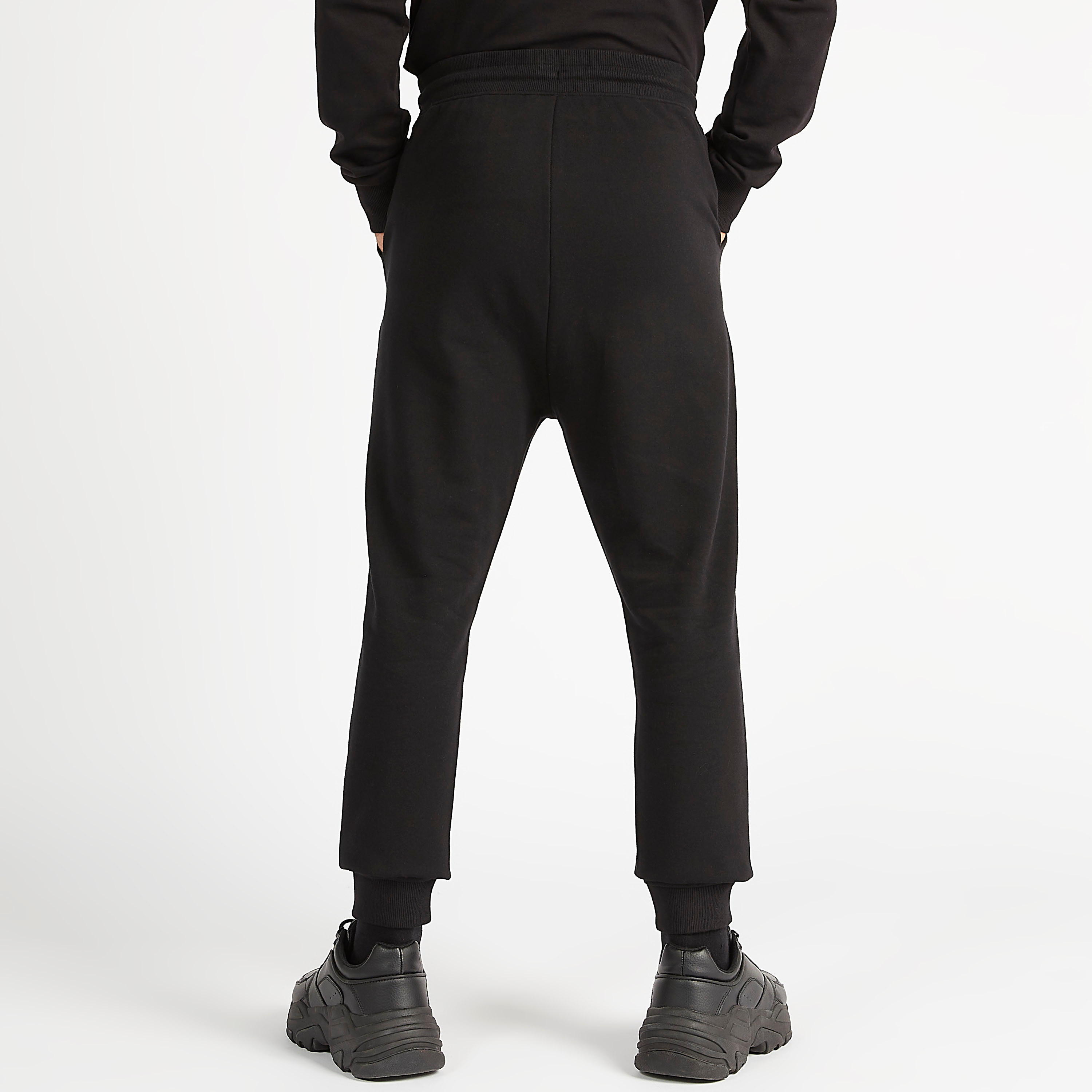 بنطلون رياضي بخصر متوسّط الارتفاع وجيوب وطبعات باتمان ورباط إغلاق-men-clothing-bottoms-joggers-image-2