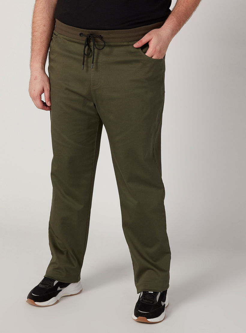 بنطلون سادة بخصر مطّاطي متوسط الارتفاع وجيوب-men-clothing-bottoms-trousersandchinos-trousers-image-1