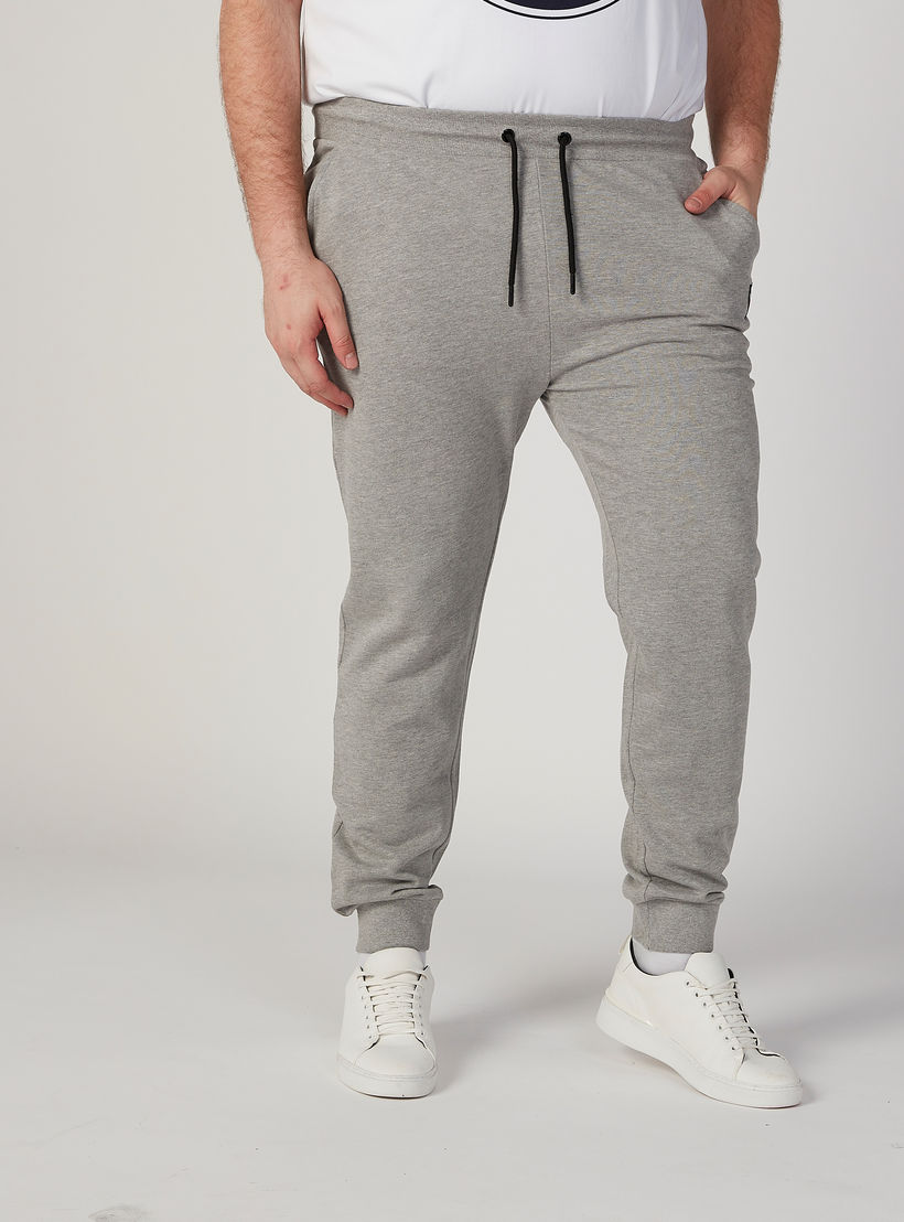 بنطلون رياضي بارز الملمس بخصر متوسط الارتفاع وجيوب-men-clothing-bottoms-joggers-image-1