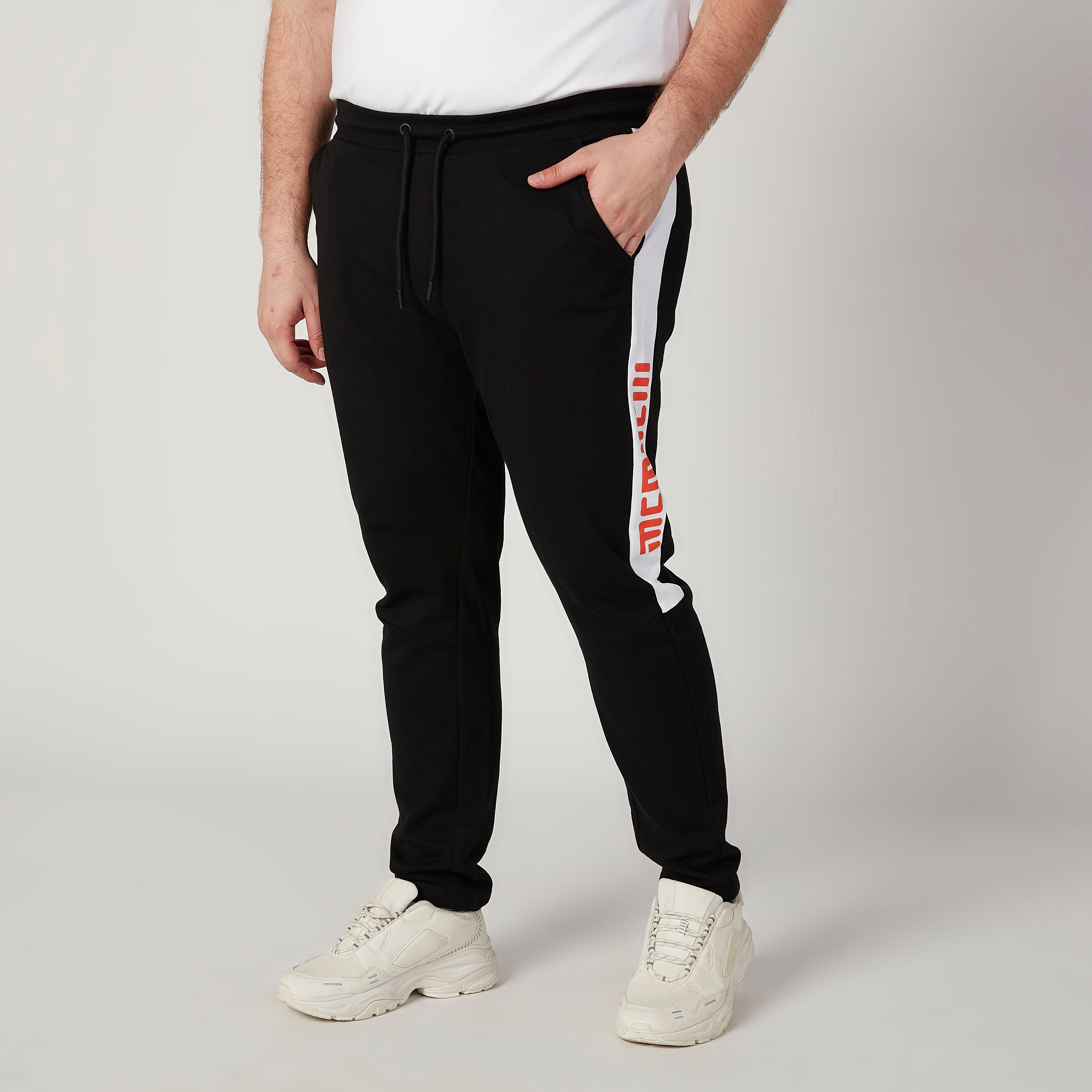 بنطلون رياضي بخصر مطّاطي متوسط الارتفاع وجيوب وطبعات-men-clothing-bottoms-joggers-image-1