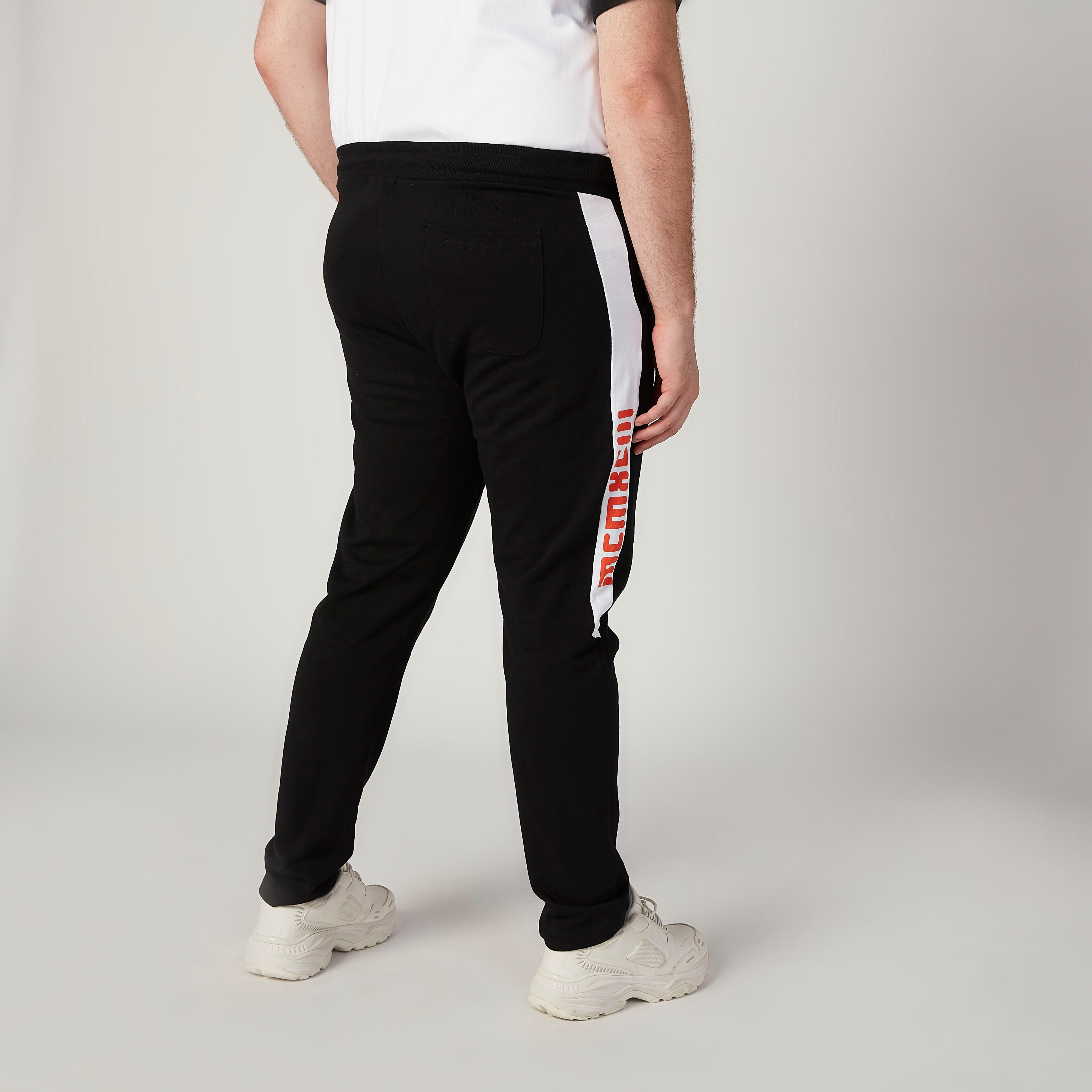 بنطلون رياضي بخصر مطّاطي متوسط الارتفاع وجيوب وطبعات-men-clothing-bottoms-joggers-image-4